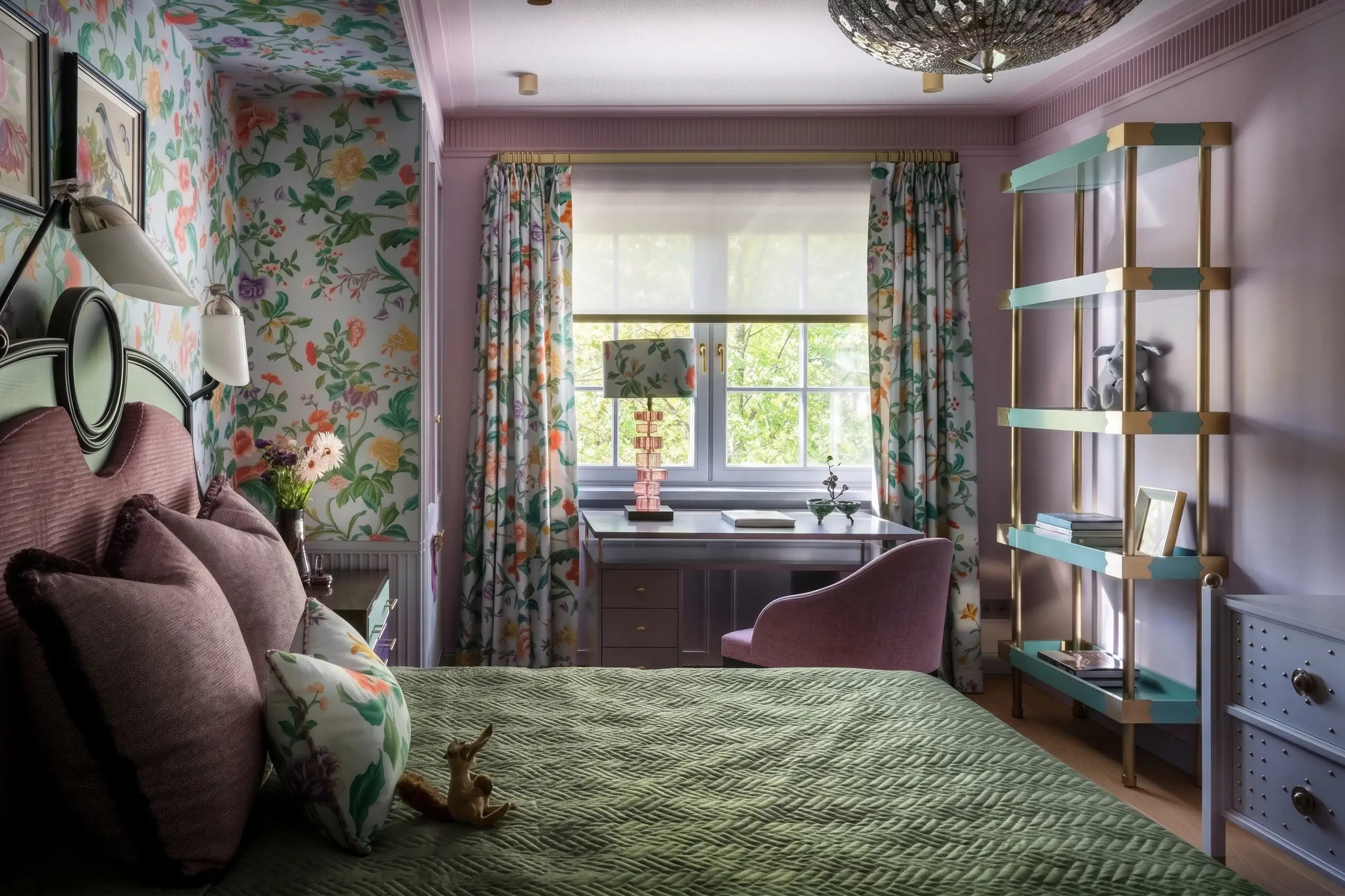 Decorative bedroom with floral wallpaper, colorful curtains, and a bookshelf.