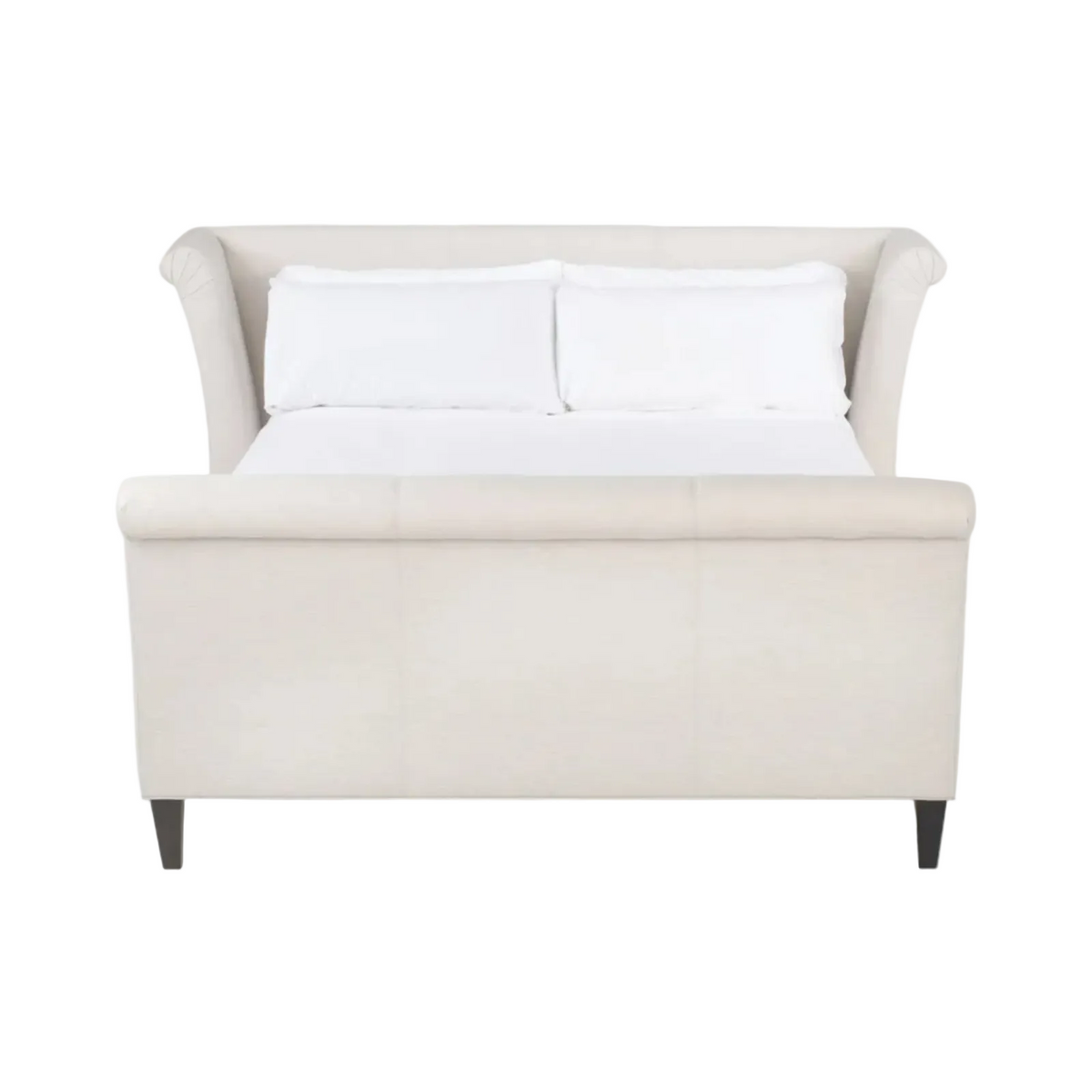 An upholstered bed with a cream-colored frame, featuring rolled arms, a padded headboard, a footboard, and two white pillows on a white mattress, set against a plain white background.