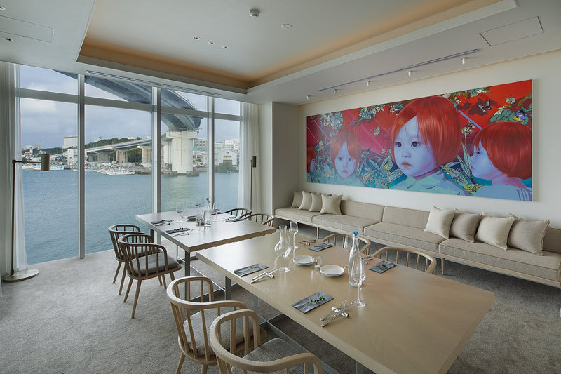 Modern interior with a large window view, dining table, and wall art.