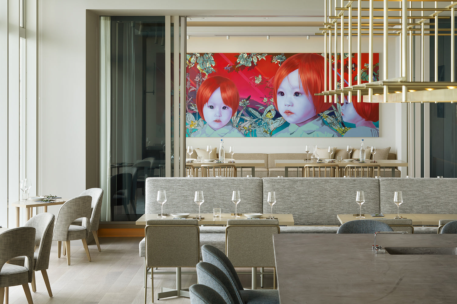 Modern dining room with a large abstract painting on the wall