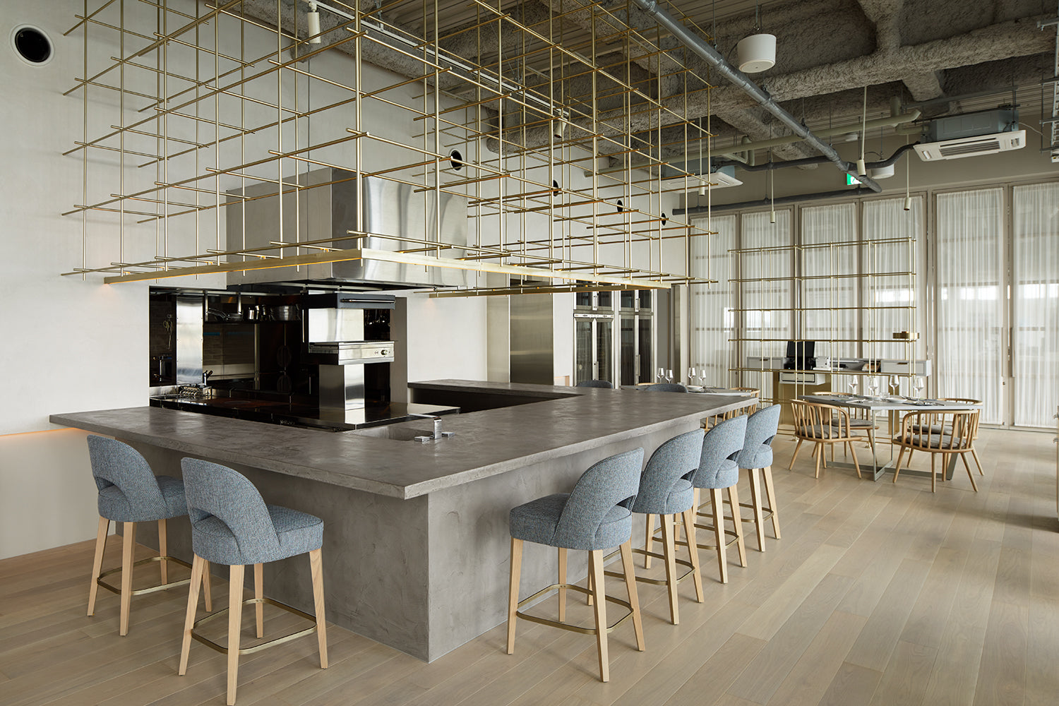 Modern kitchen with island and stools in a stylish interior setting