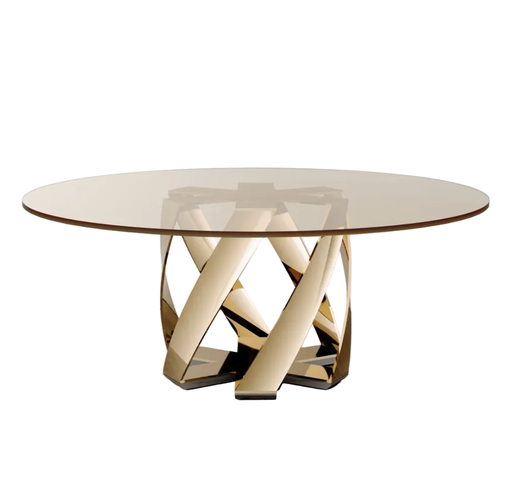 A round glass-top dining table with a sculptural metallic base made of interlocking curved rods, shown in a minimalist studio setting with a light gray wall and concrete floor.