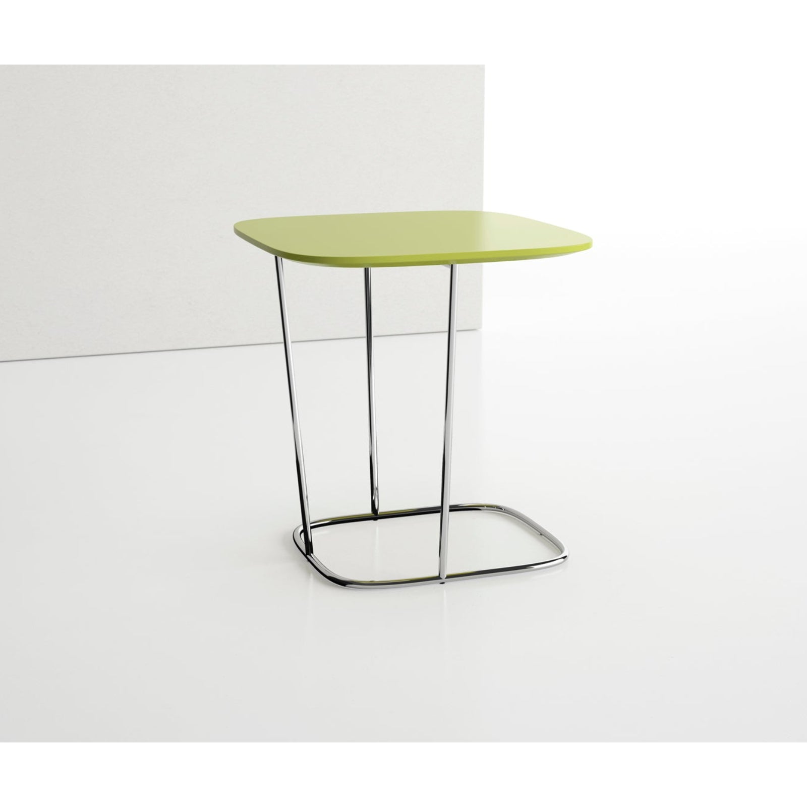 Green side table with metal legs on a white background