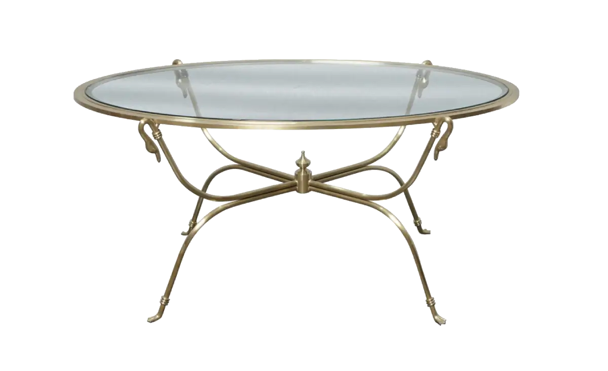 Round glass-top table with a polished brass or gold metal frame and ornate curved legs, shown on a plain white background.