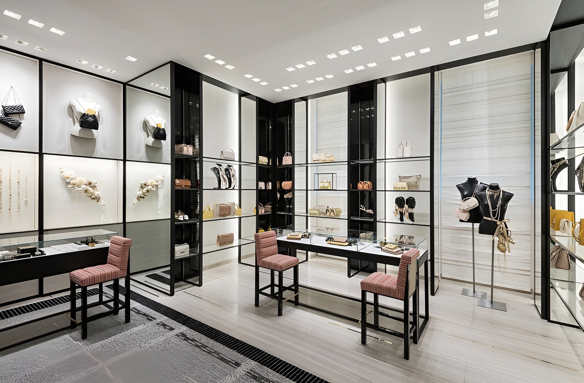 Modern interior design with glass display cases, chairs, and decor elements.