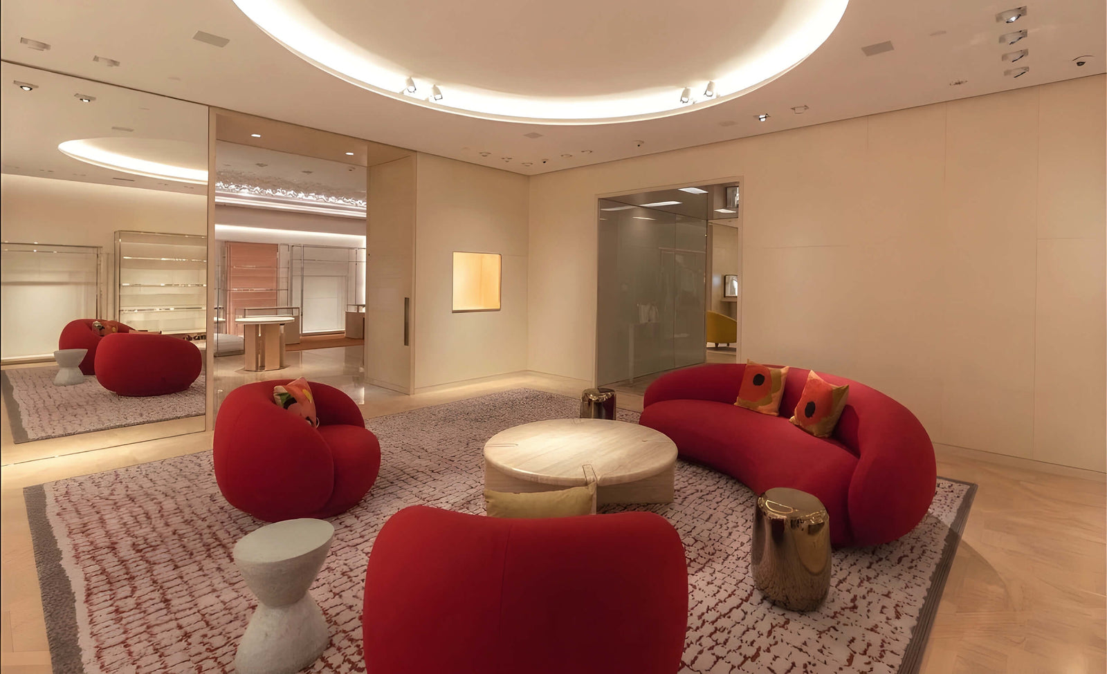 Modern interior design with red furniture and a round ceiling light.