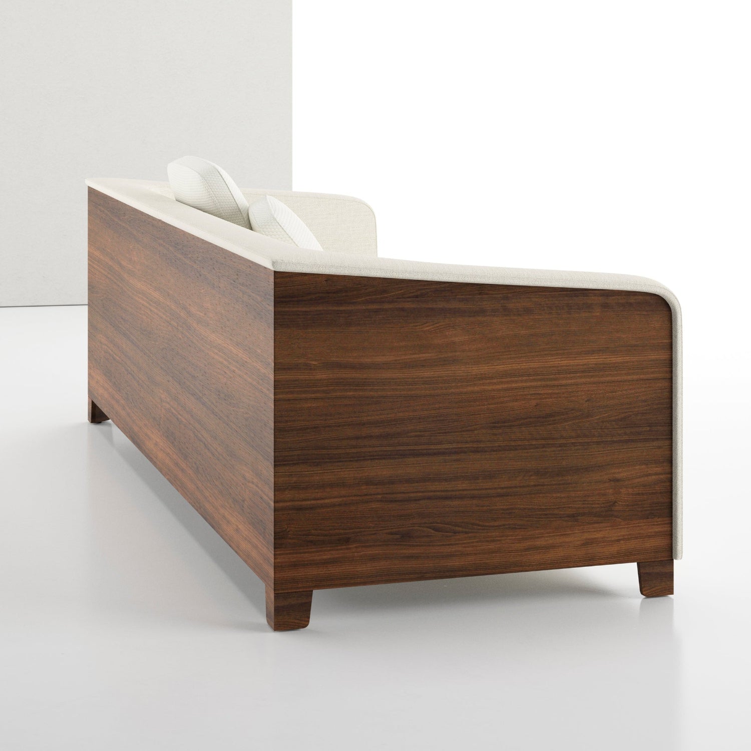 A modern low-profile sofa with a dark brown wood grain side panel, white backrest, and white cushions, shown in a minimalist white studio setting.